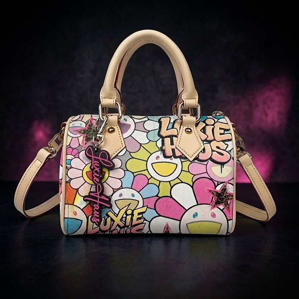 Daisy Luxe Mini floral designer handbag front view with top handle and signature keychain charm by Luxie Haus