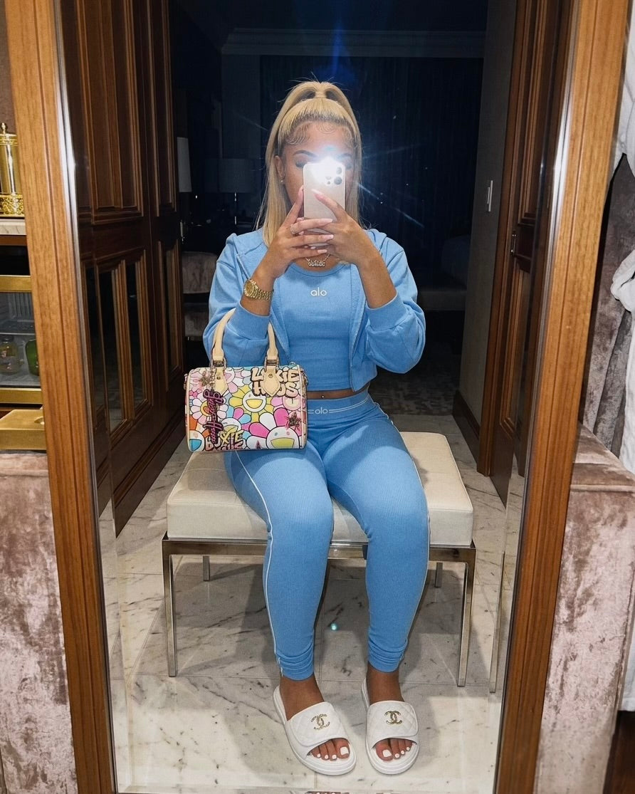 Daisy Luxe Mini floral designer handbag by Luxie Haus worn as a top handle mini bag with crossbody strap