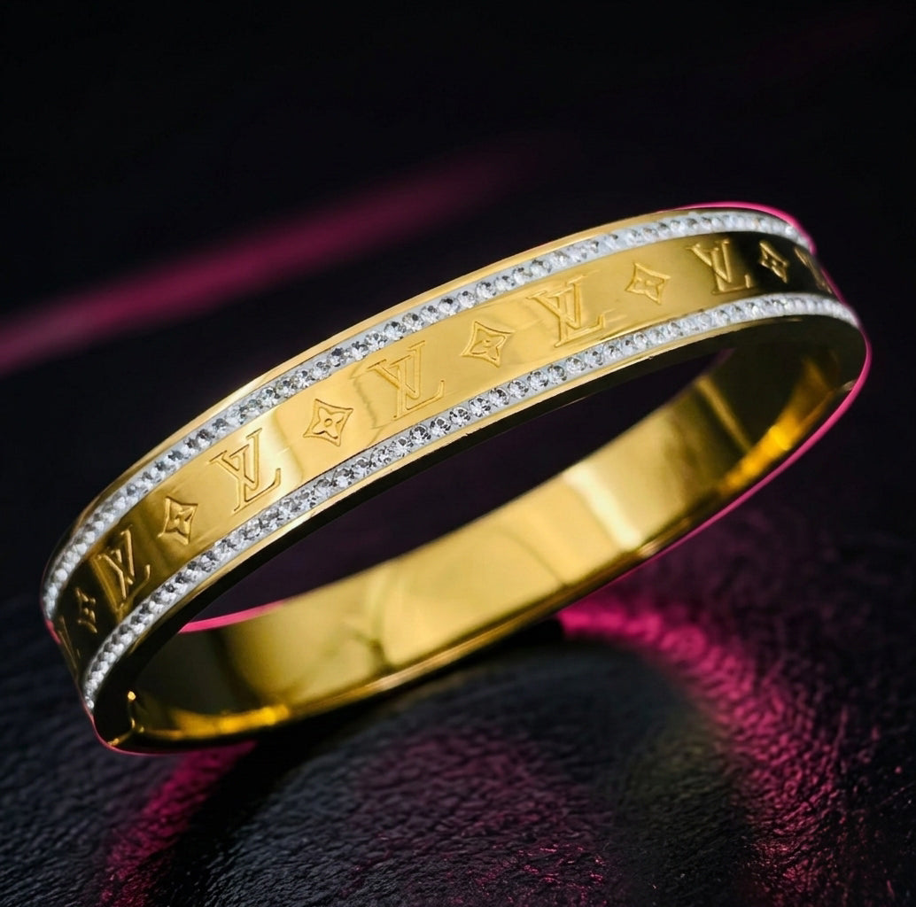 gold engraved bangle bracelet with luxury monogram design
