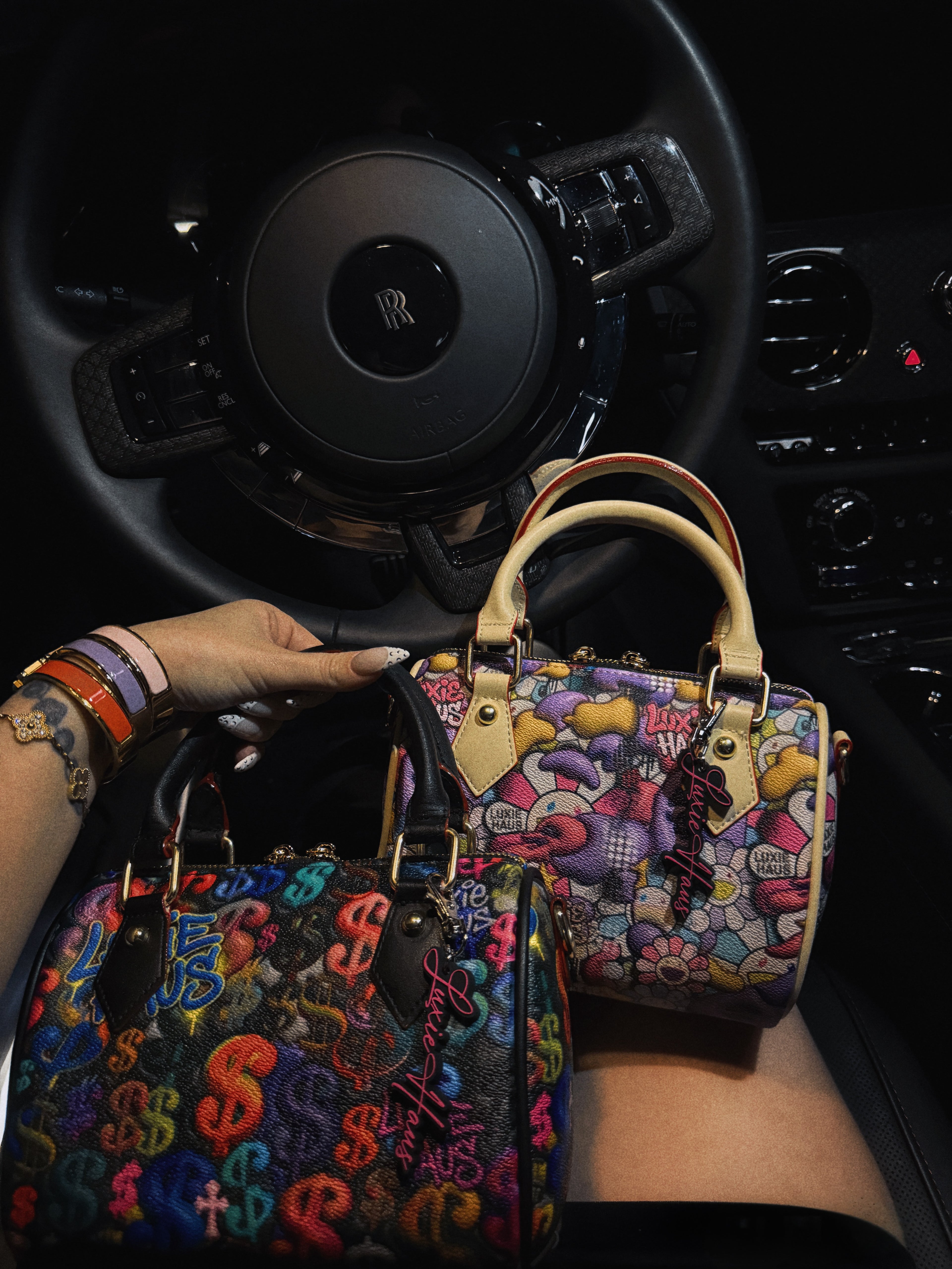Luxie Haus Rich Girl Mini handbags with colorful money print shown in car, top handle and crossbody styles